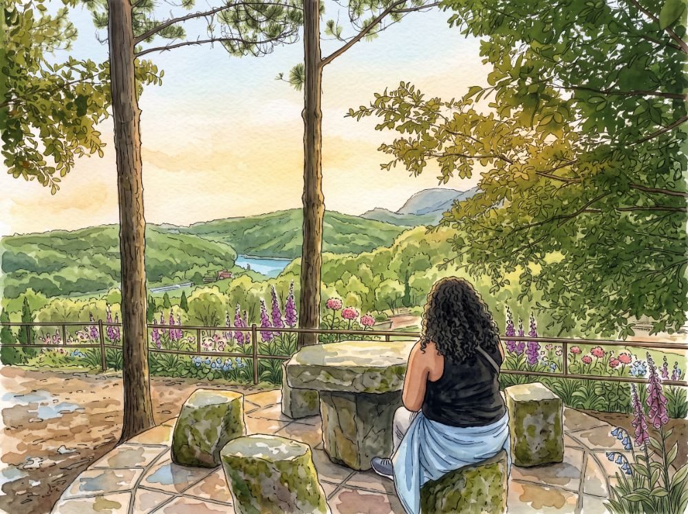 A watercolor of a woman seated at a stone table looking out over a green valley